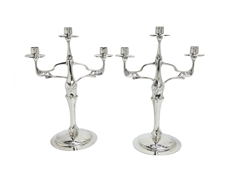 A set of candle holders designed by Friedrich Adler and produced in polished pewter by OSIRIS Metallwarenfabrik für Kleinkunst Walter Scherf & Co