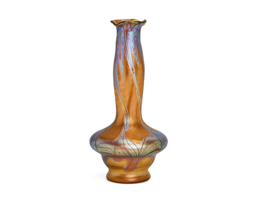 Art Nouveau vase by Johann Loetz Witwe, executed in Phänomen Genre 1/214, blown in orange glass with a richly iridescent surface featuring the characteristic flowing lines and delicate color reflections typical of the Phänomen Genre.