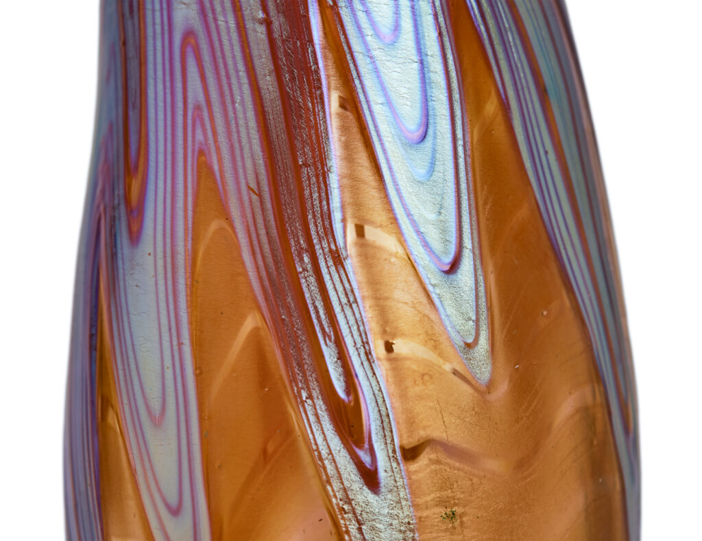Art Nouveau vase by Johann Loetz Witwe, executed in Phänomen Genre 1/214, blown in orange glass with a richly iridescent surface featuring the characteristic flowing lines and delicate color reflections typical of the Phänomen Genre.