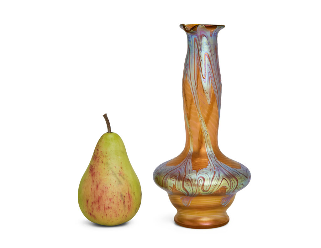 Art Nouveau vase by Johann Loetz Witwe, executed in Phänomen Genre 1/214, blown in orange glass with a richly iridescent surface featuring the characteristic flowing lines and delicate color reflections typical of the Phänomen Genre.